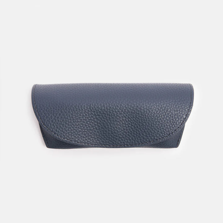 Caroline Gardner navy flap glasses case with a secure closure, designed to protect and store eyeglasses in style.