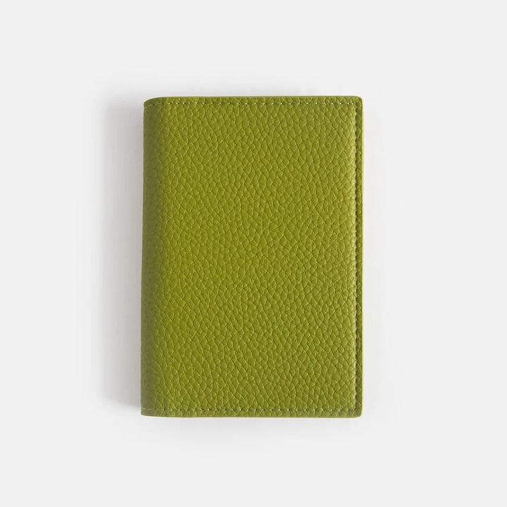 Caroline Gardner green embossed passport holder with floral pattern, made for travel and gift-giving, by Cornucopia Home and Gift.