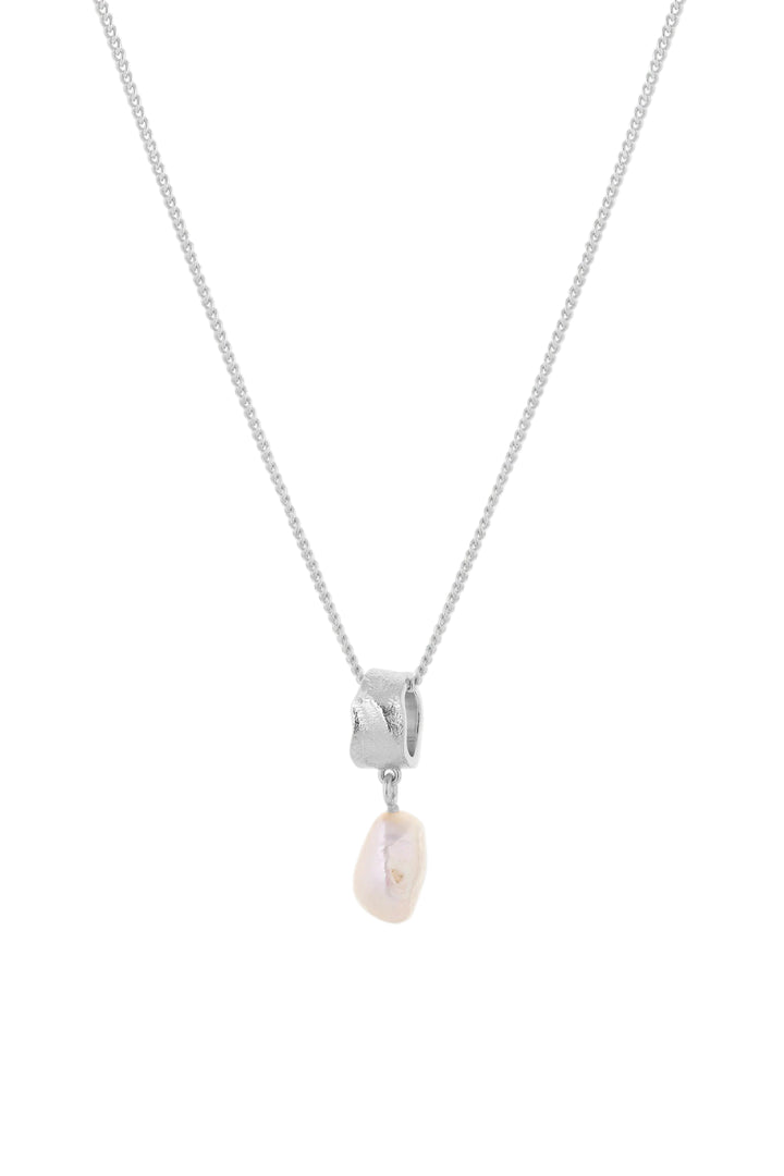 Freshwater pearl necklace by Tutti &amp; Co featuring silver chain and elegant white pearls on a neutral background.
