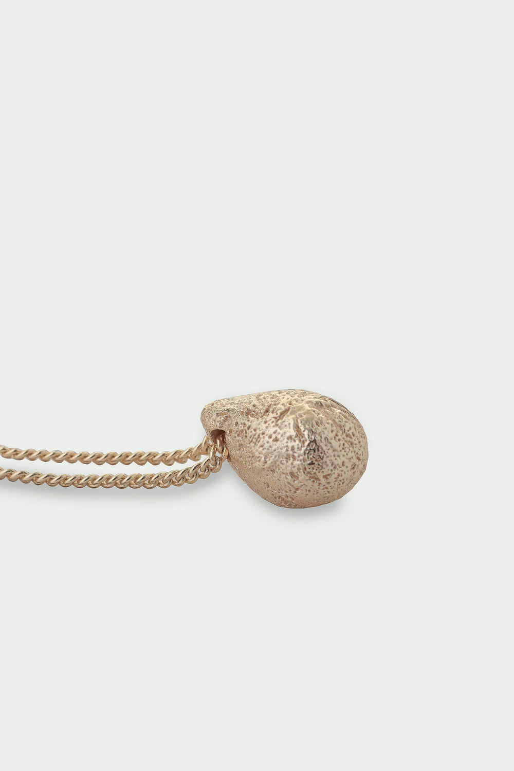 Gold Dome Necklace by Tutti & Co featuring a smooth, rounded pendant on a delicate chain, styled for elegant wear.