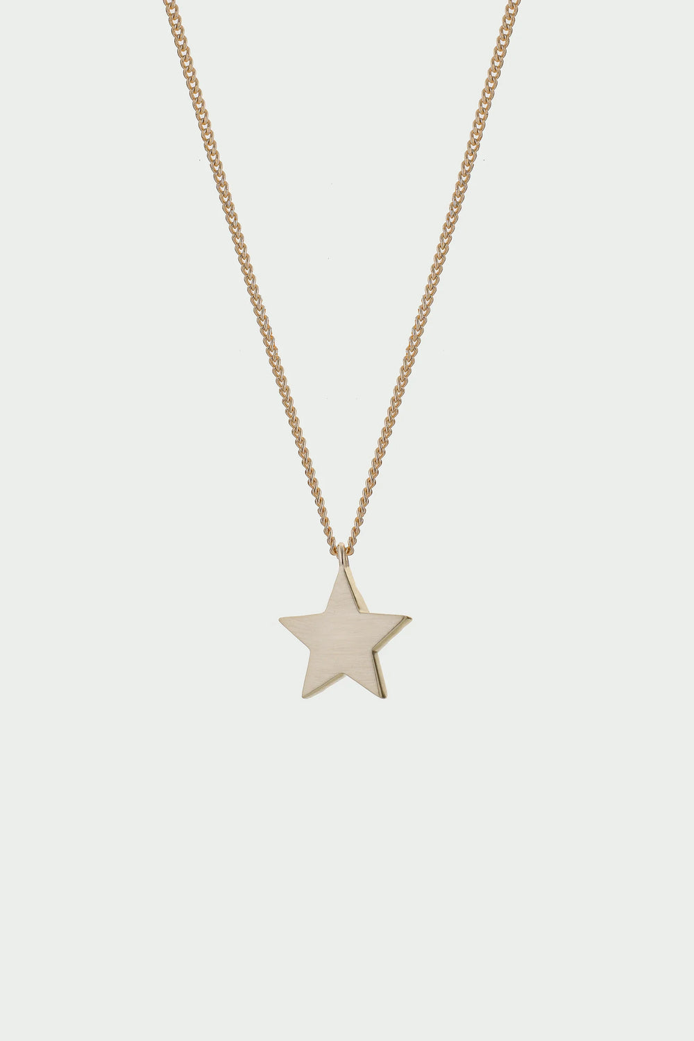 Gold Cosma Necklace by Tutti & Co, featuring a delicate chain and elegant pendant, displayed on a neutral background.
