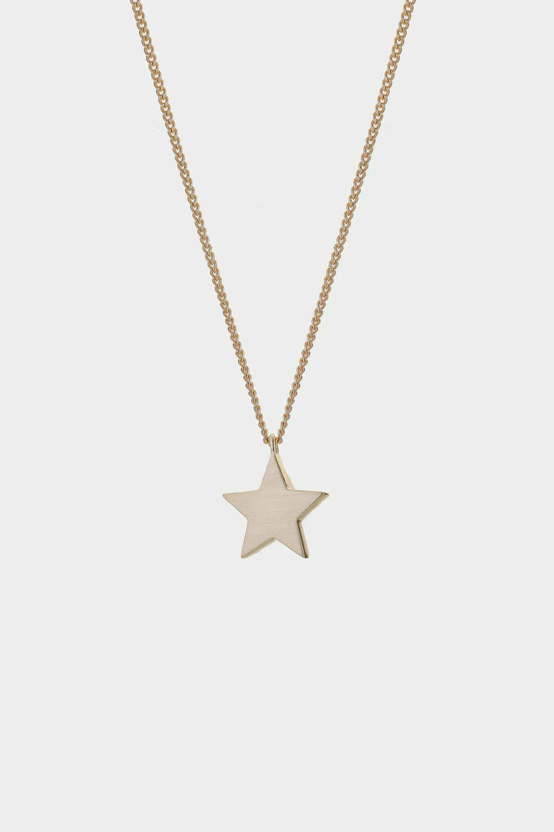 Gold Cosma Necklace by Tutti &amp; Co, featuring a delicate chain and elegant pendant, displayed on a neutral background.