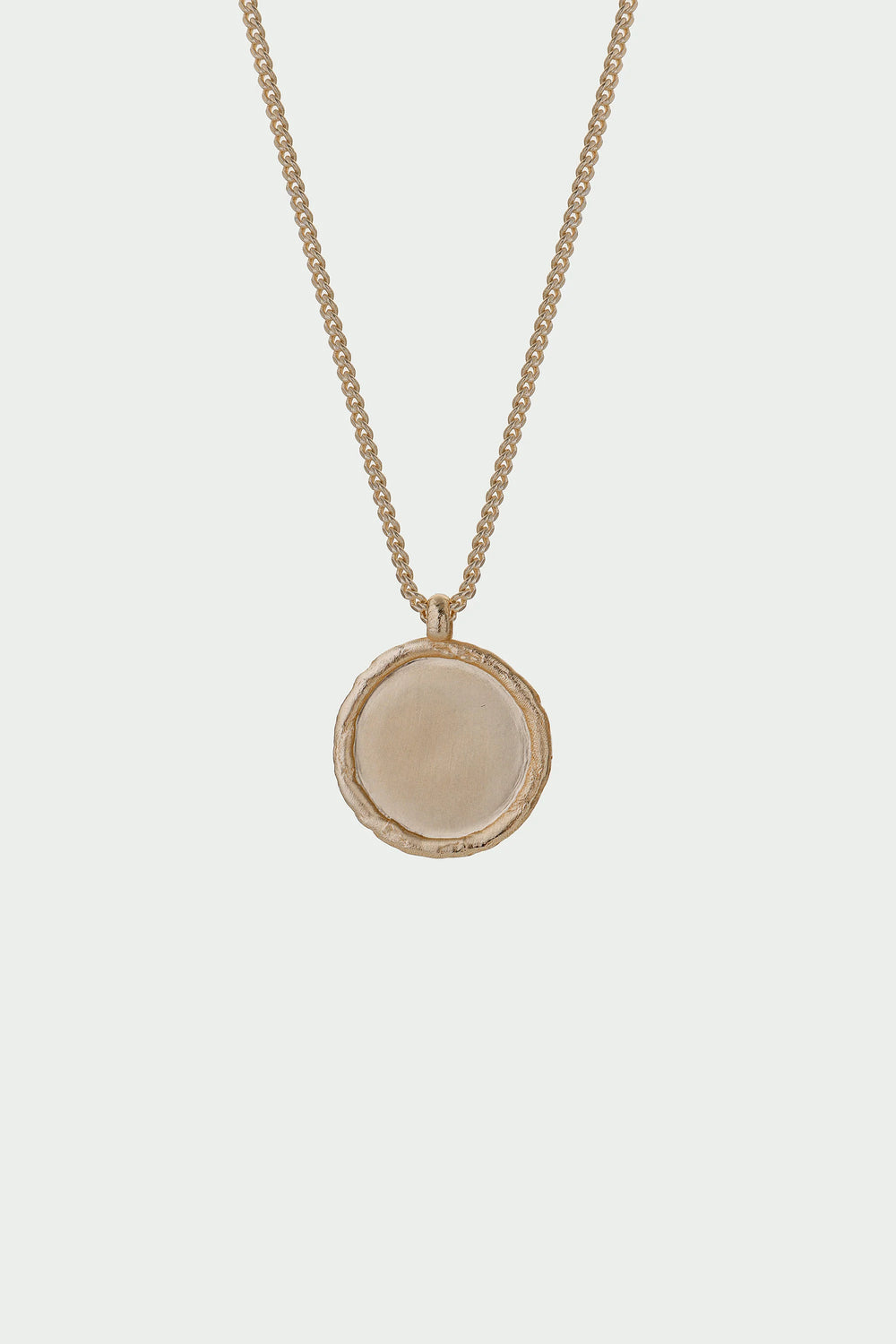 Gold Arc Necklace by Tutti & Co featuring a sleek, curved design, displayed on a neutral background.