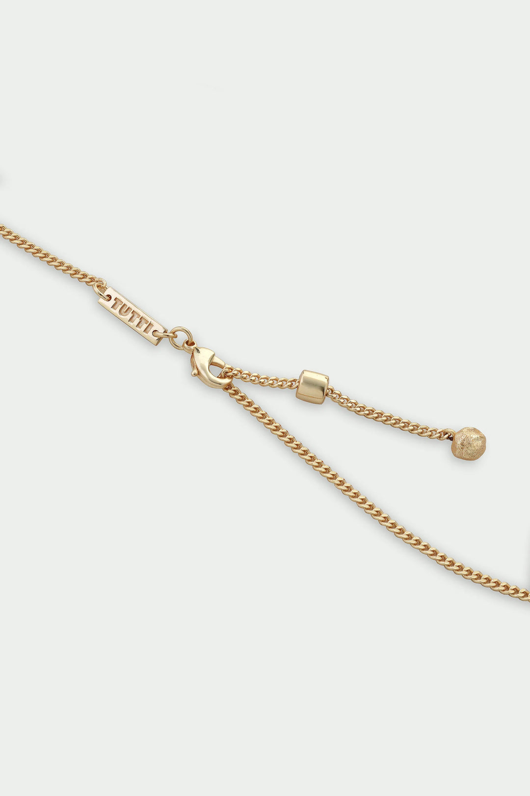 Gold Halo Necklace by Tutti &amp; Co featuring a delicate circular pendant, displayed on a neutral background.