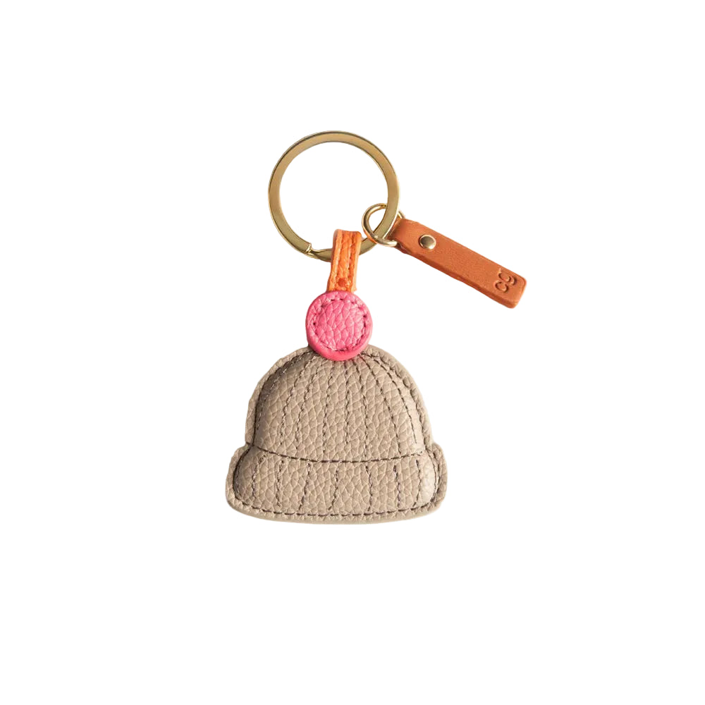 Caroline Gardner pom pom beanie hat with novelty keyring, featuring colorful pom poms and playful design, perfect as a gift accessory.