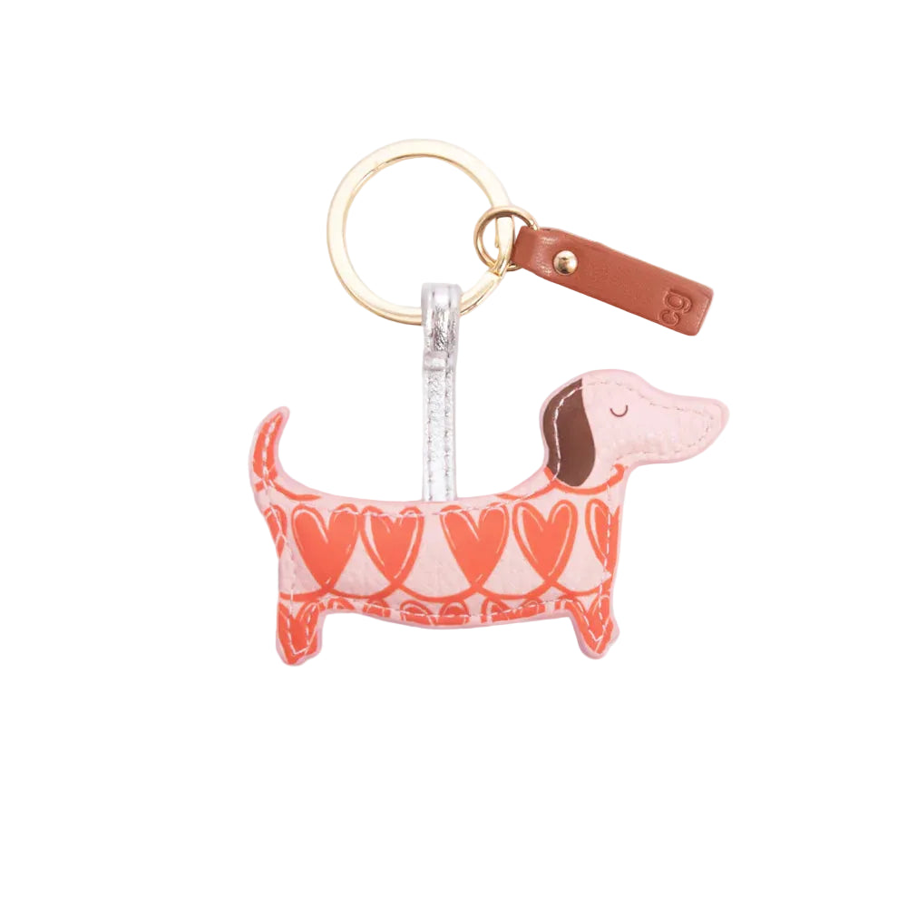Keychain shaped like a dachshund with heart pattern on a white background