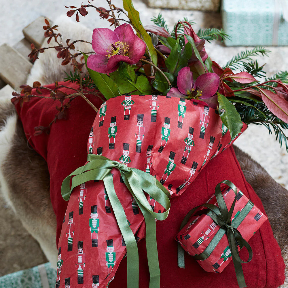 Four sheets of Botanical Nutcracker Tissue Paper by Cornucopia Home and Gift, featuring colorful nutcracker and botanical designs.