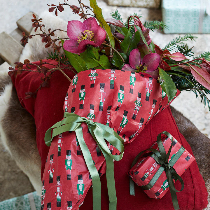 Four sheets of Botanical Nutcracker Tissue Paper by Cornucopia Home and Gift, featuring colorful nutcracker and botanical designs.