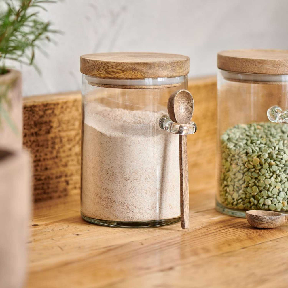 Small Nkuku Kossi storage jar with a rustic, handcrafted design, perfect for kitchen or pantry organization.
