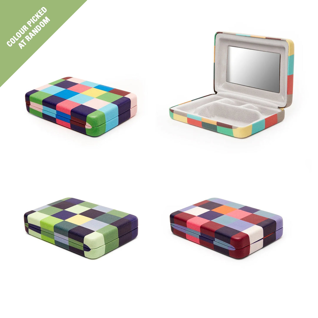 Kikkerland plaid travel jewelry case with multiple compartments for organizing necklaces, rings, and earrings.