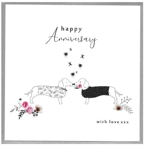 Cinnamon Aitch Happy Anniversary Sausage Dogs decorative figurines by Cornucopia Home and Gift displayed on a surface