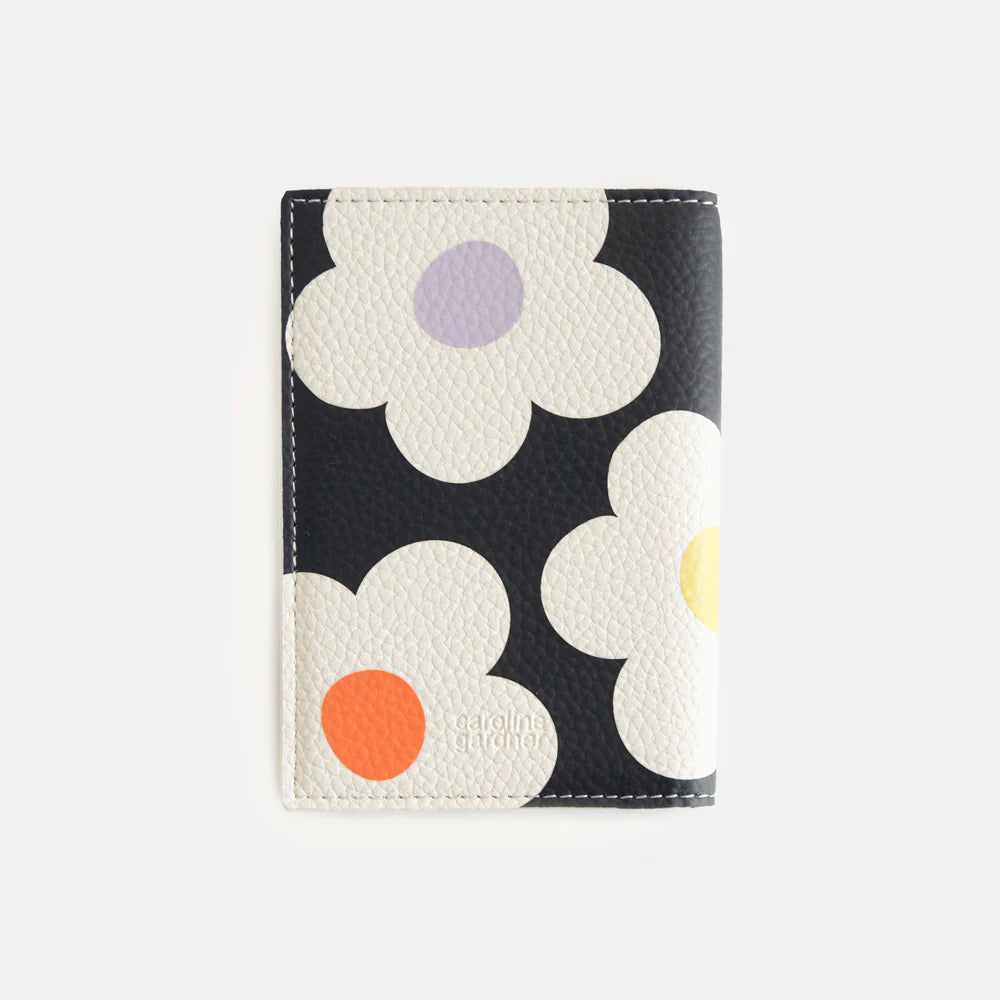 Caroline Gardner multi-flower charcoal passport holder with floral pattern, designed for secure travel document storage.