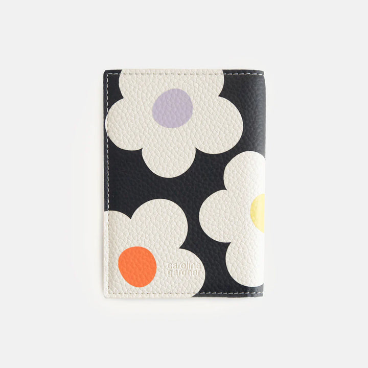 Caroline Gardner multi-flower charcoal passport holder with floral pattern, designed for secure travel document storage.