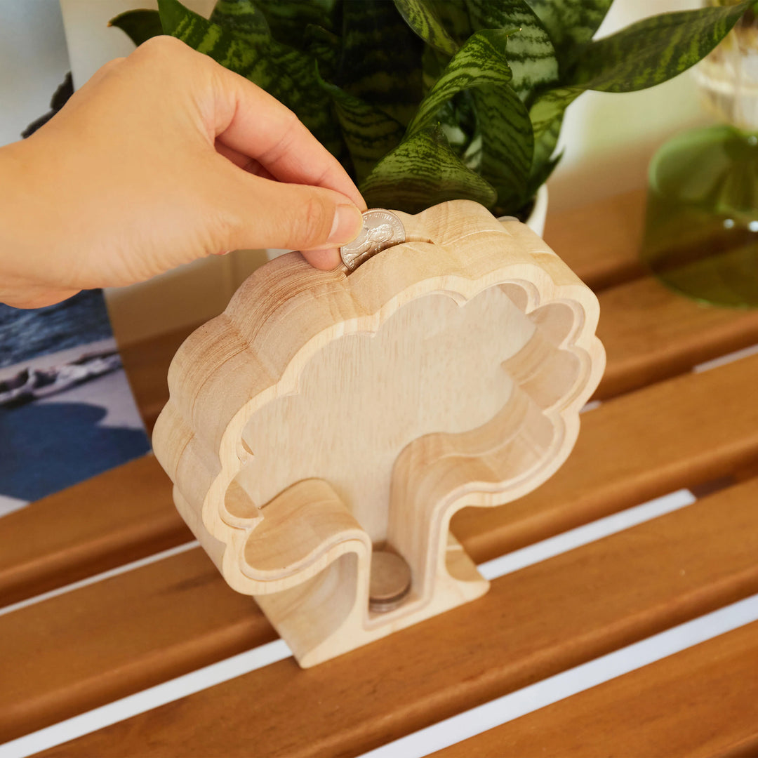 Kikkerland Money Tree Bank by Cornucopia Home and Gift, a decorative ceramic coin bank shaped like a money tree plant.