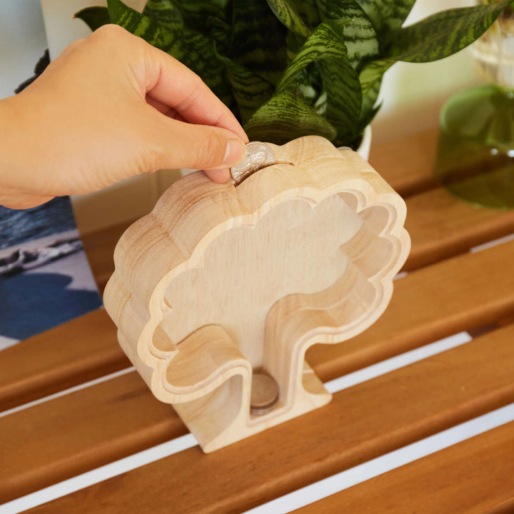 Kikkerland Money Tree Bank by Cornucopia Home and Gift, a decorative ceramic coin bank shaped like a money tree plant.