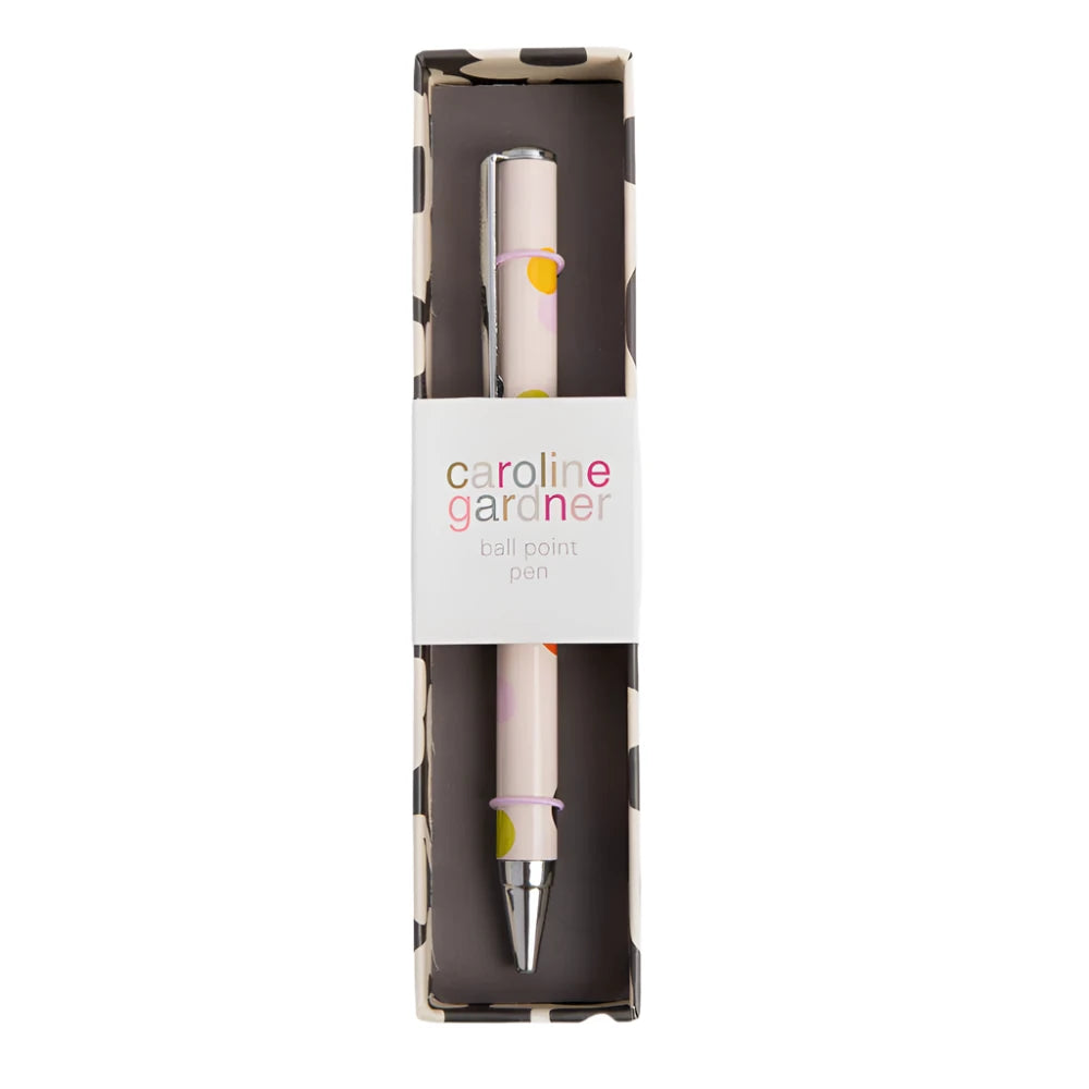 Pale pink Caroline Gardner Dotty Ballpoint Pen with gold accents, perfect for gifting or everyday writing.
