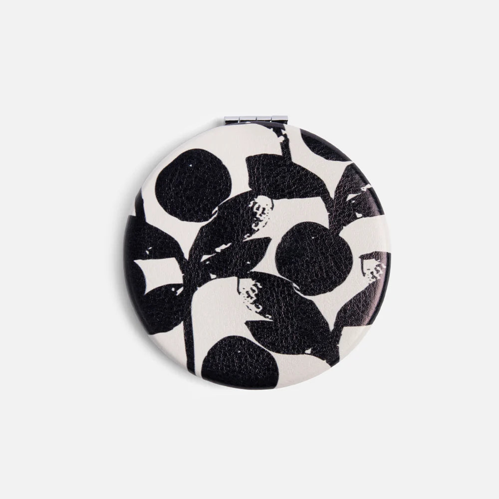 Caroline Gardner Mono Bloom round pocket mirror with floral design and compact size for easy carrying and personal use.