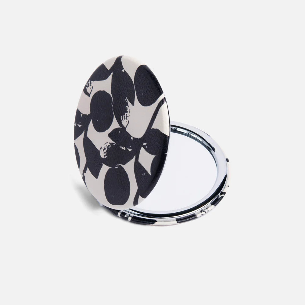 Caroline Gardner Mono Bloom round pocket mirror with floral design and compact size, ideal for on-the-go use.