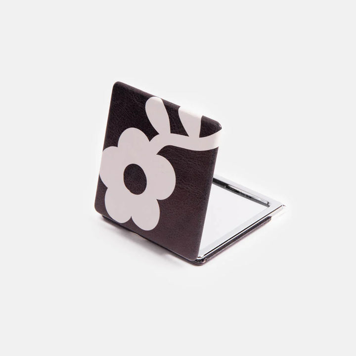 Caroline Gardner charcoal mono flower square pocket mirror with floral design, perfect as a gift, displayed on a neutral background.