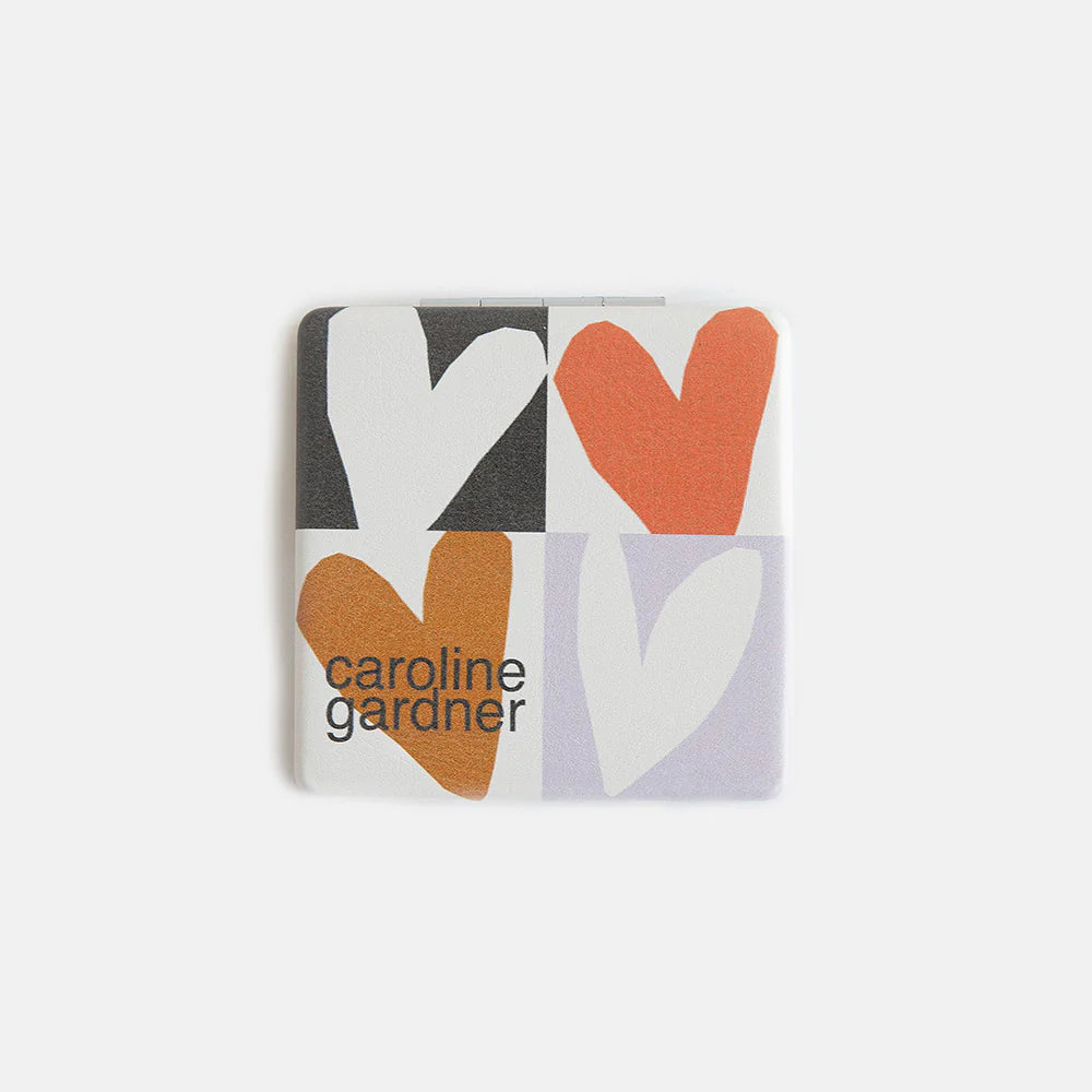 Caroline Gardner multi checkmate hearts square pocket mirror with colorful heart pattern and compact design.