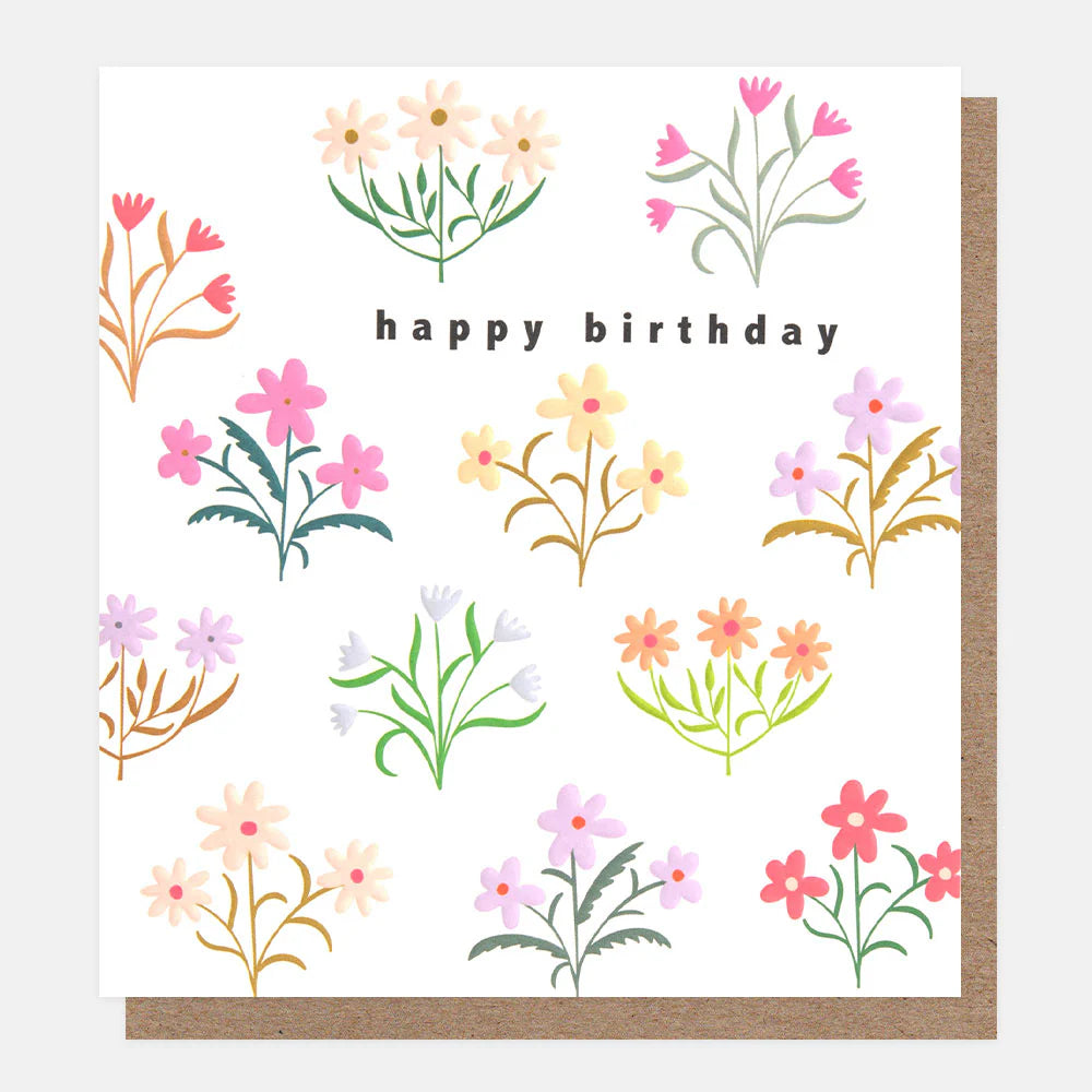 Caroline Gardner Happy Birthday card with assorted floral pattern featuring colorful blooms on a white background.