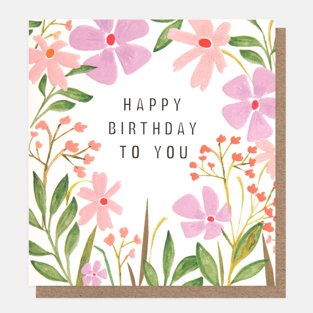 Caroline Gardner Happy Birthday To You pink and lilac floral frame with colorful birthday message and decorative floral border.
