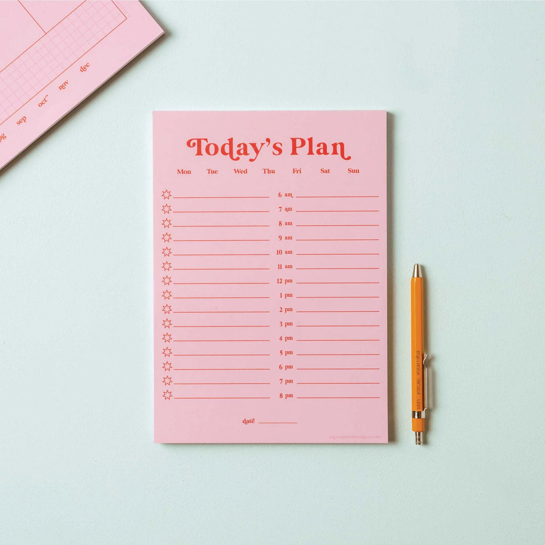 Pink and red A5 daily planner pad from Good Tuesday by Cornucopia Home and Gift, featuring a sleek, organized design.