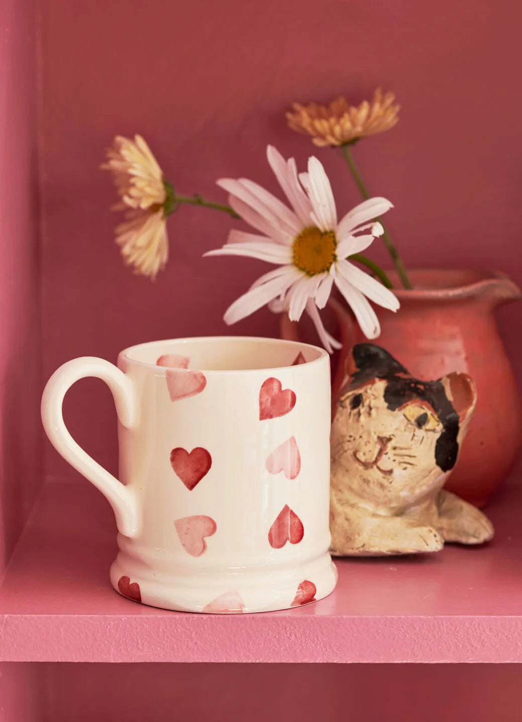 Emma Bridgewater Pink Hearts 1/2 Pint Mug with pink heart pattern, ceramic, featuring a classic mug shape and vibrant pink design.