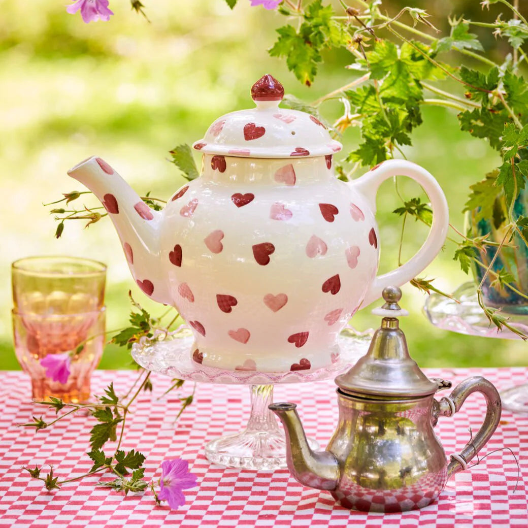 Emma Bridgewater pink hearts teapot with matching 4 mug set, featuring charming pink heart design on white ceramic.