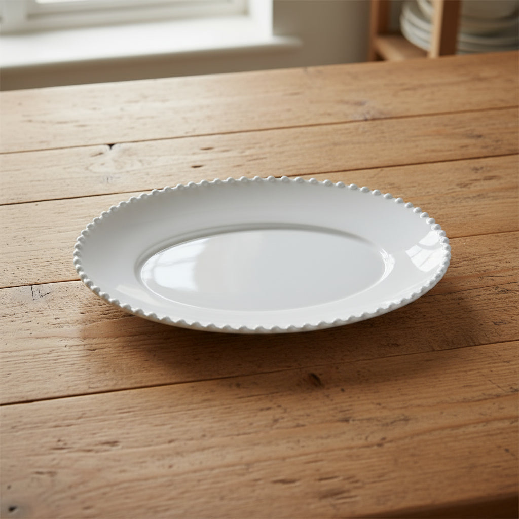 Pearl white oval platter by Cornucopia Home and Gift, 34cm, elegant ceramic serving dish with smooth finish and classic design.