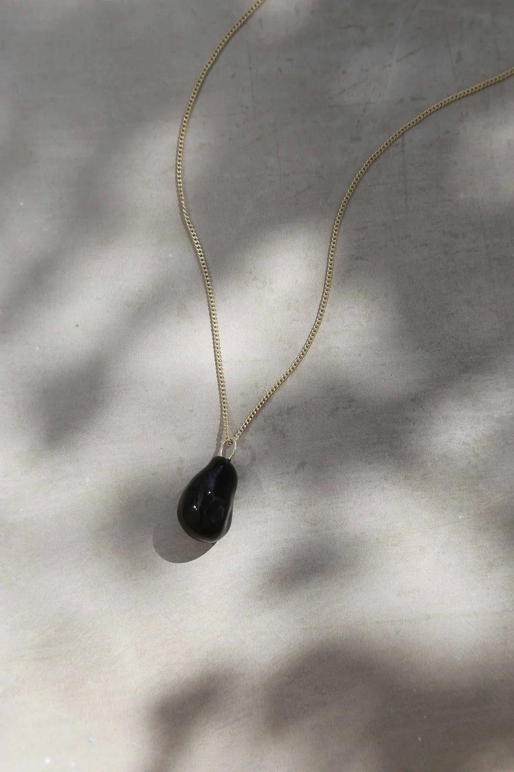 Black enamel Portobello necklace by Tutti & Co featuring a stylish, handcrafted jewelry piece on a delicate chain.