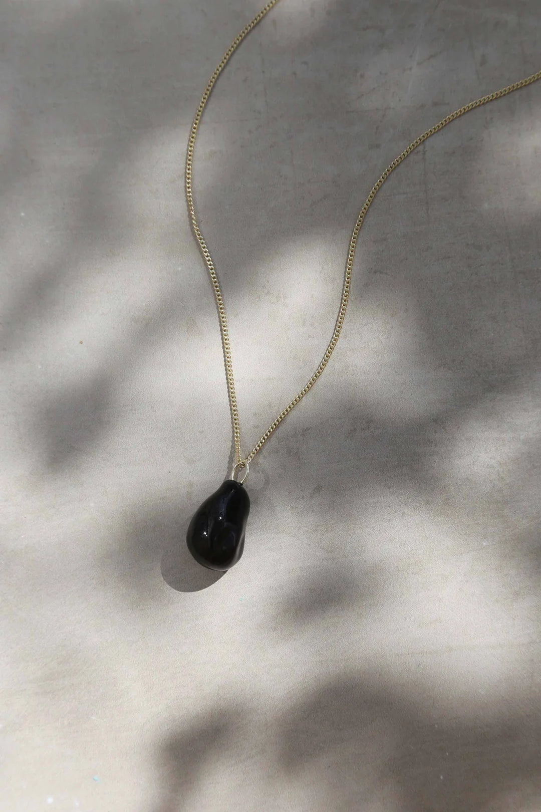 Black enamel Portobello necklace by Tutti &amp; Co featuring a stylish, handcrafted jewelry piece on a delicate chain.