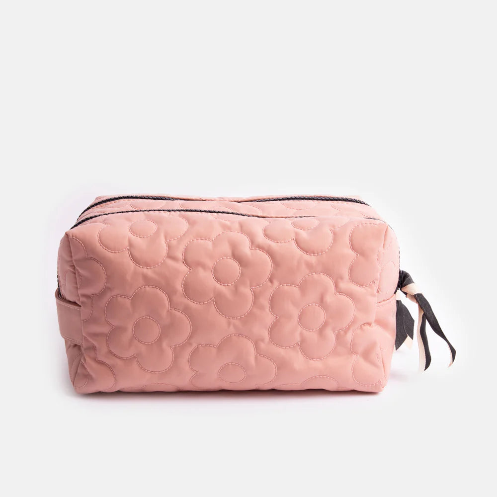 Pink quilted flower cube washbag by Caroline Gardner featuring a floral pattern and compact design for travel toiletries.