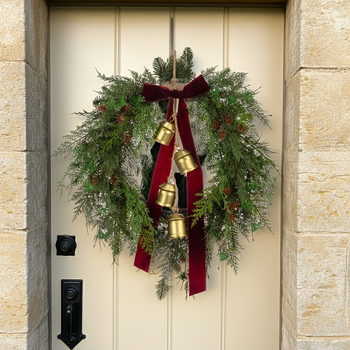 Belmesthorpe floral silk Christmas wreath with bow and bells, festive holiday decor by Cornucopia Home and Gift.