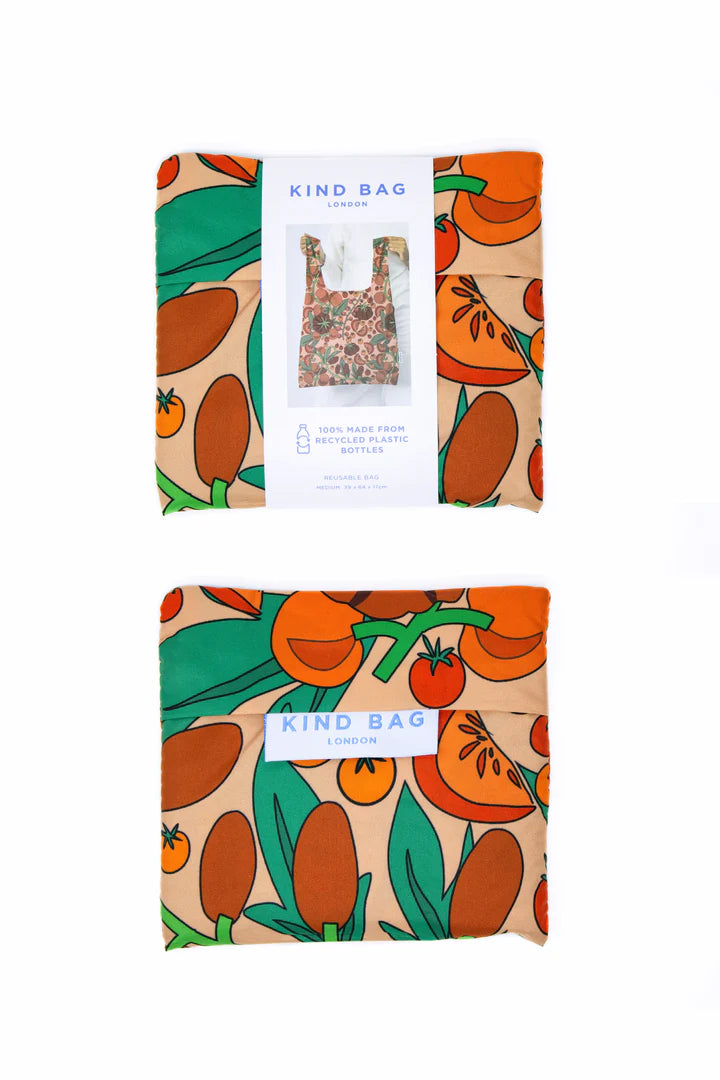 Close-up of medium-sized tomatoes inside a pink reusable bag by Kind Bags, from Cornucopia Home and Gift.