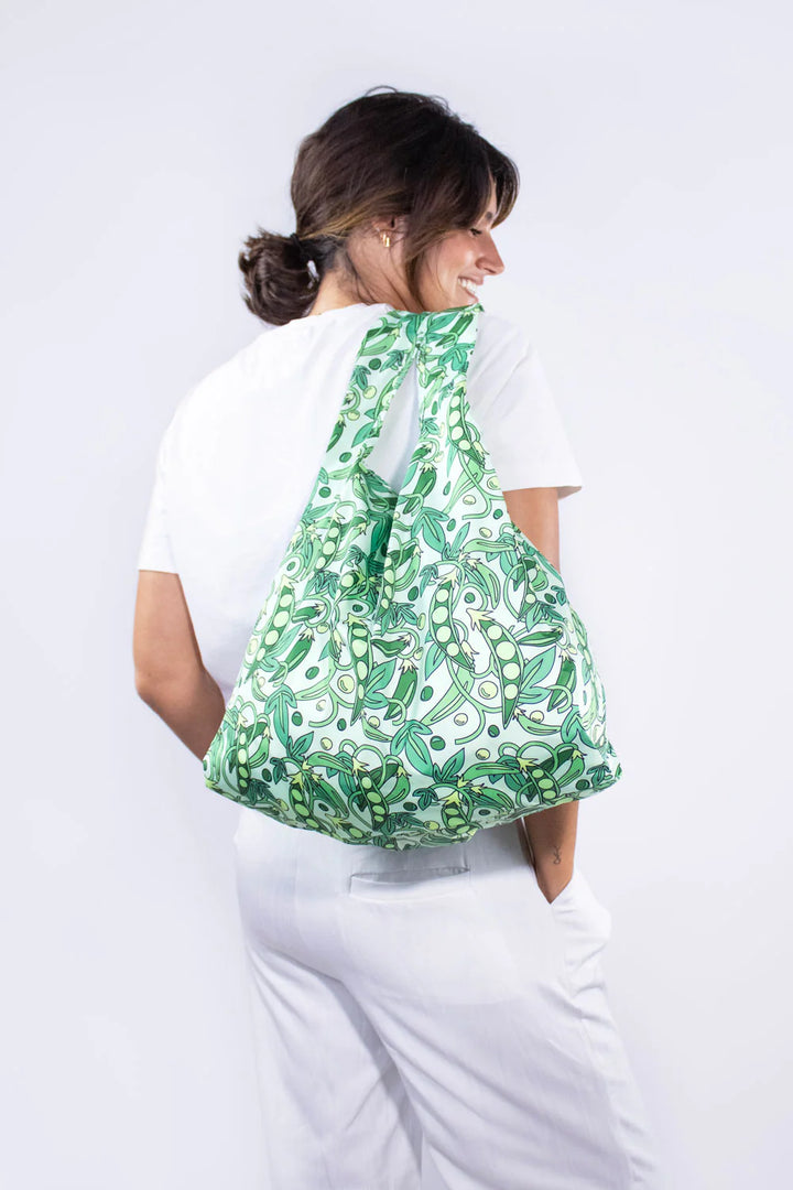 Medium reusable bag from Kind Bags by Cornucopia Home and Gift featuring a peas pattern, designed for eco-friendly storage.