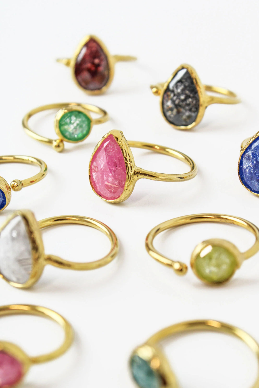 Set of small circle and teardrop rings from My Doris by Cornucopia Home and Gift, arranged on a neutral background.