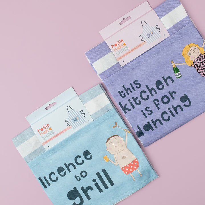 Rosie Made a Thing Kitchen Dancing Apron in range of colors, featuring a playful design with adjustable straps and front pockets.