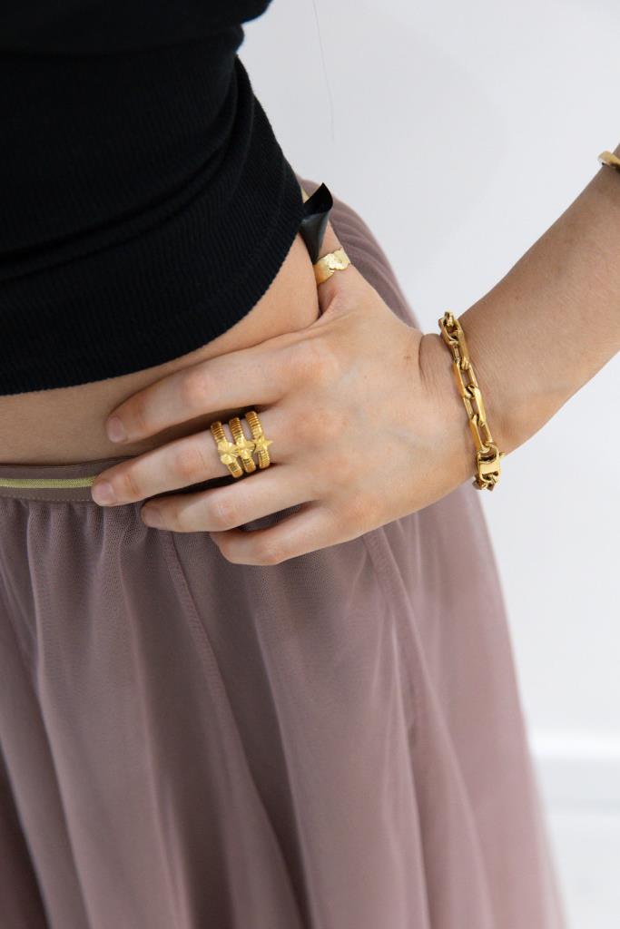 White leaf Ridged Clover Band Ring by Cornucopia Home and Gift, featuring a textured clover design on a sleek band.