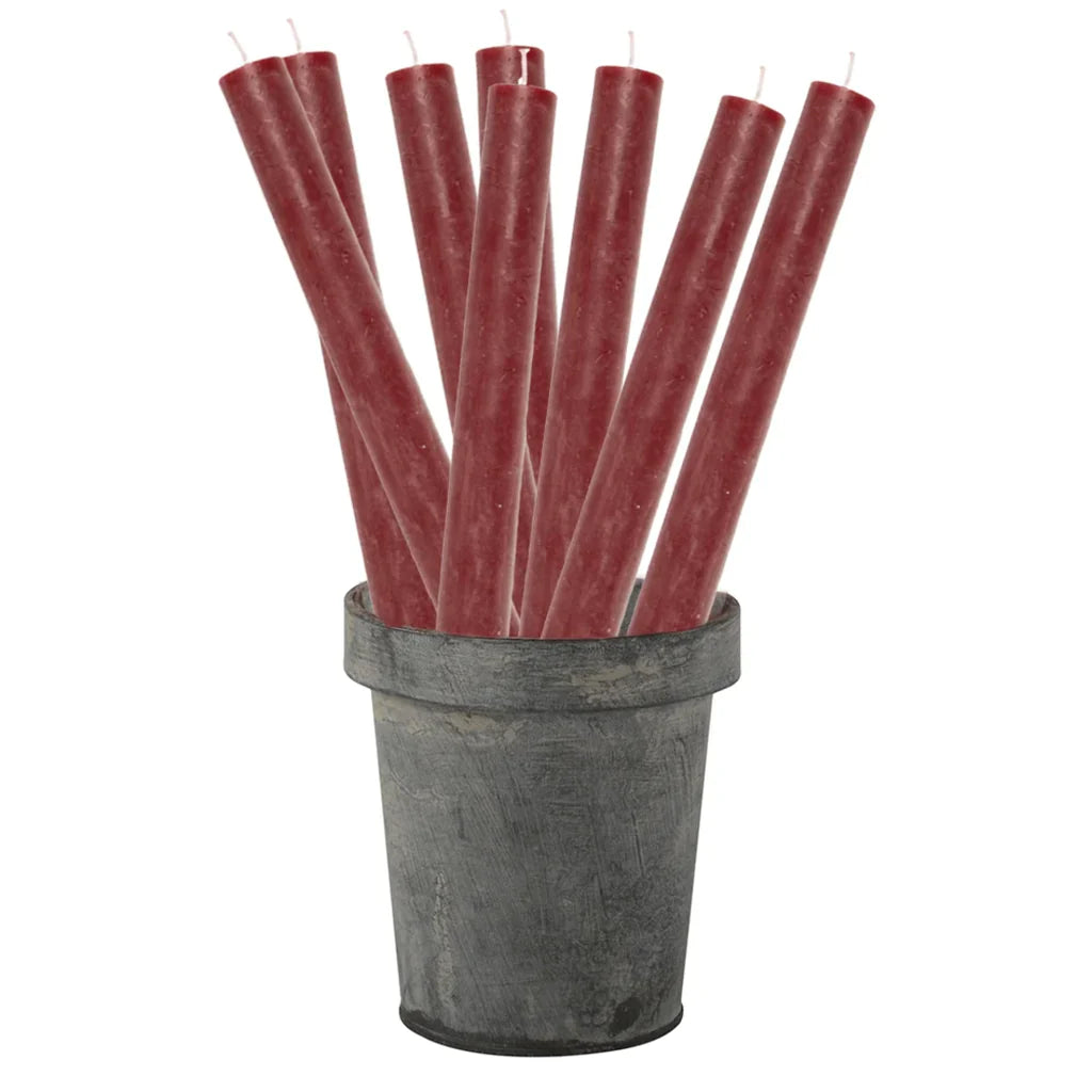 Rustic plum-colored dinner candle from Grand Illusions by Cornucopia Home and Gift, 27cm tall, with a textured rustic appearance.
