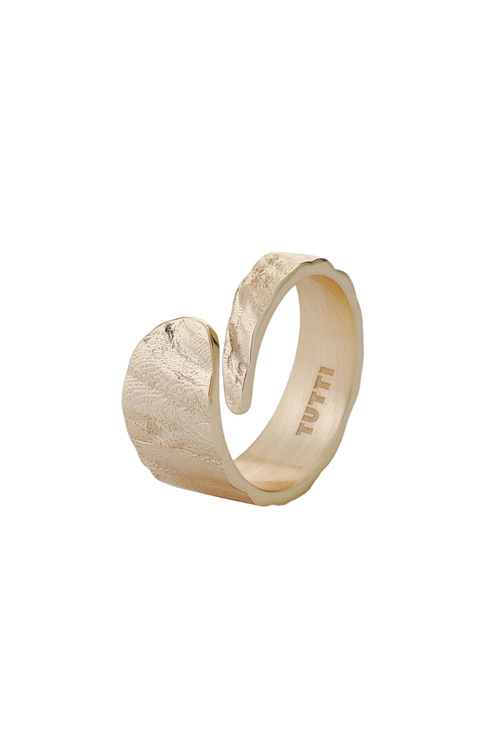 Gold Riva Ring by Tutti &amp; Co, featuring a sleek, modern design with a shiny finish, displayed on a neutral background.