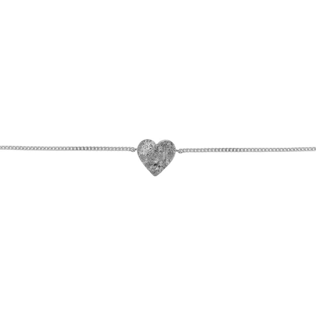 Silver Spirit Bracelet by Tutti & Co featuring intricate design, displayed on a neutral background.