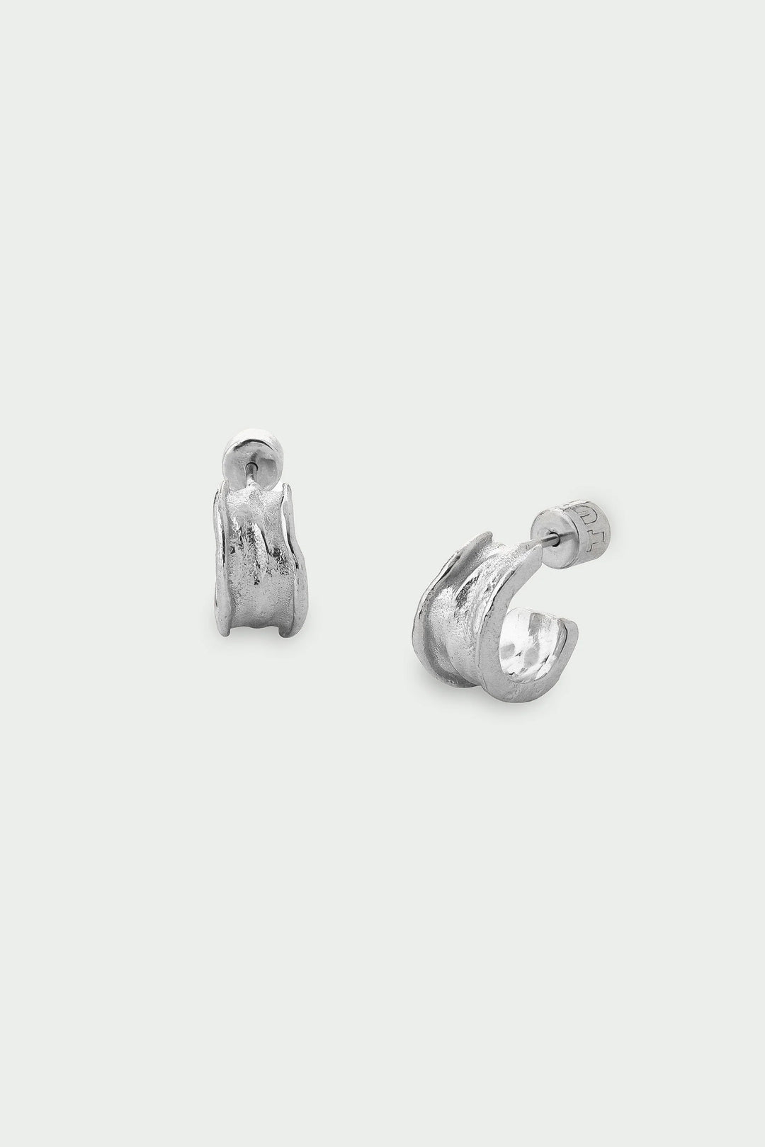 Silver Driftline Earrings by Tutti &amp; Co featuring sleek, modern design with a shiny silver finish, displayed on a plain background.