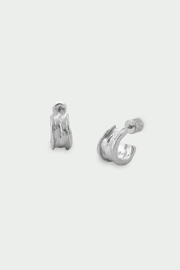 Silver Driftline Earrings by Tutti &amp; Co featuring sleek, modern design with a shiny silver finish, displayed on a plain background.