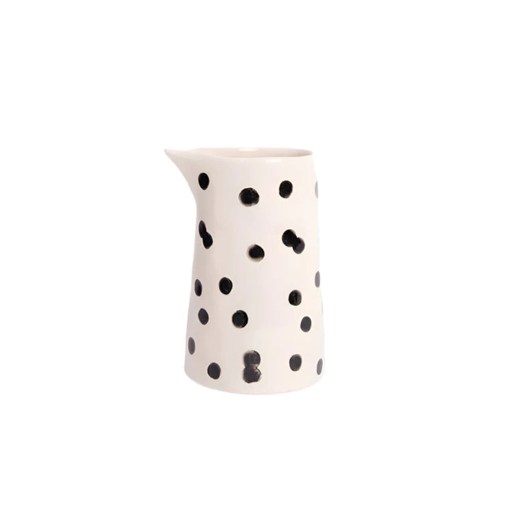Caroline Gardner mono dotty small milk jug with white background, featuring a charming polka dot design in pastel colors.