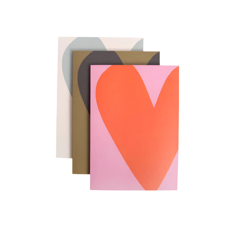 Set of three Caroline Gardner Colourblock Hearts notebooks featuring vibrant heart designs, perfect for gifting or personal use.