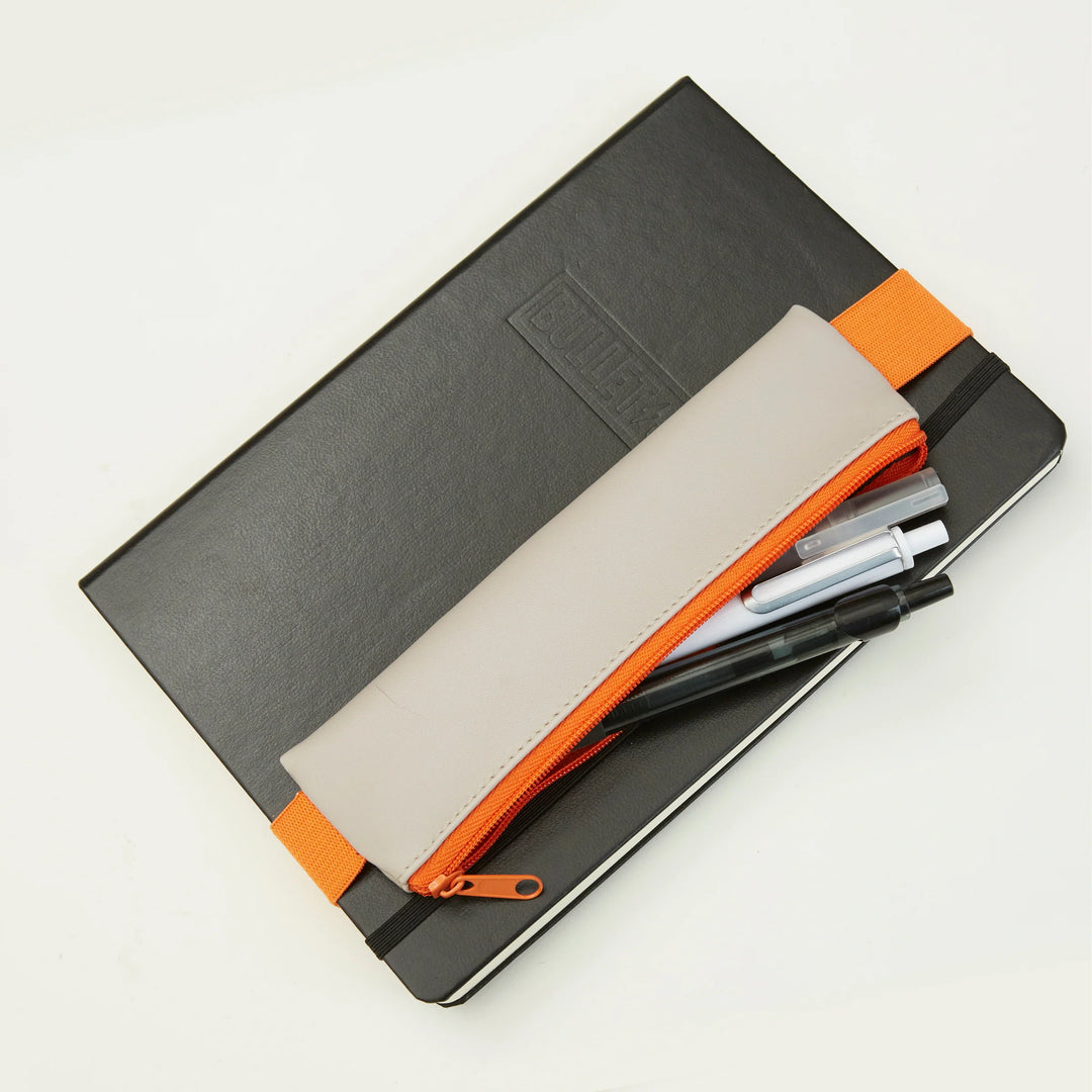 Kikkerland assorted pencil pouch with colorful fabric design, compact storage for pens and pencils, by Cornucopia Home and Gift.