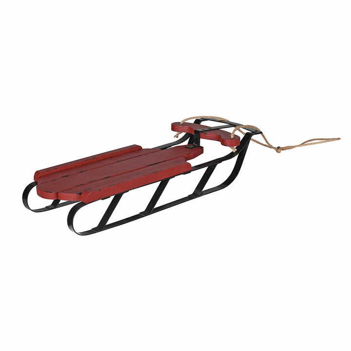 Rustic red coach house Christmas sledge by Cornucopia Home and Gift, featuring wooden construction and festive holiday design.