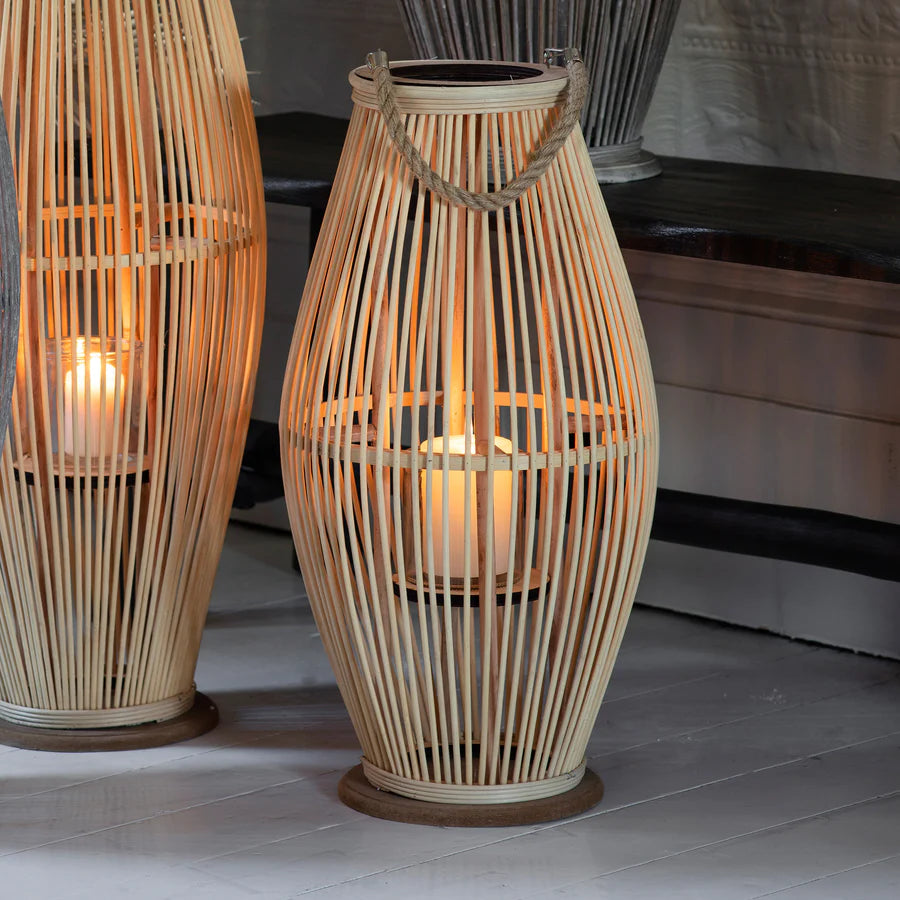 Natural-colored sandal lantern from Cornucopia Home and Gift, featuring a decorative, open-frame design perfect for outdoor decor.