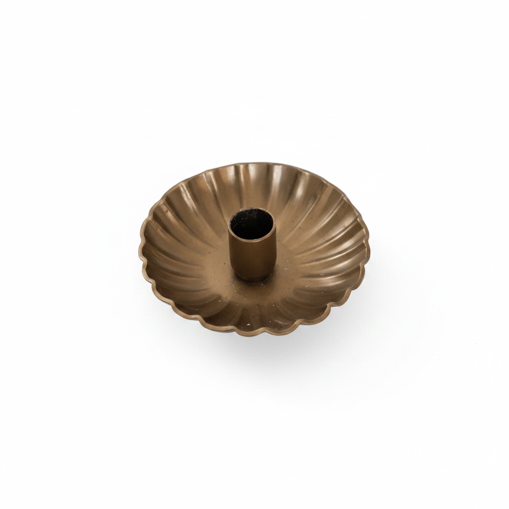 Gold decorative bowl on a wooden surface with a blurred background